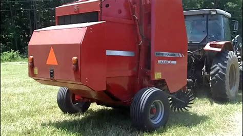 1745 Massey Round Baler with New Mesh Wrap - YouTube