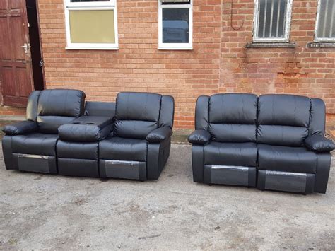 Stunning black leather sofas recliners with cup holders. 3 and 2 seaters. As new. Can deliver ...