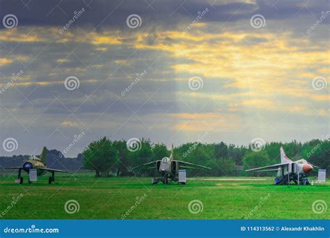 Three Military Airplanes on Green Field and Blue Sky Background. Stock ...