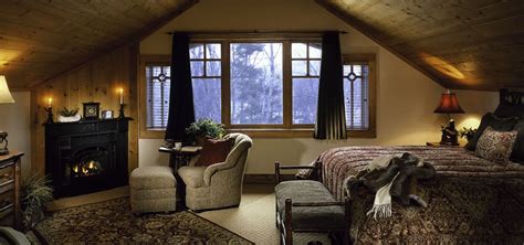 Suite bedroom with fireplace. - The Whiteface Lodge