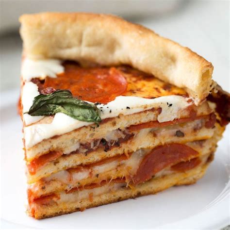 Have your cake and eat your pizza too with this hearty pizza cake layered with loads of cheese ...