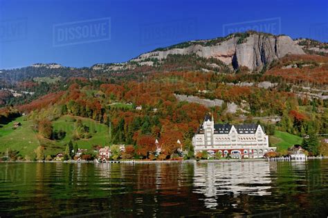 Hotel in autumn along shore of Lake Lucerne from sightseeing boat, Lake ...