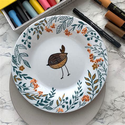 Dining & Serving Petrykivka painting on a ceramic plate. Plate Bird of ...