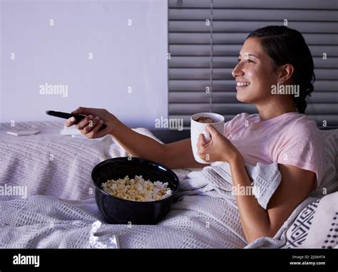 Woman alone watching movie in tv hi-res stock photography and images ...