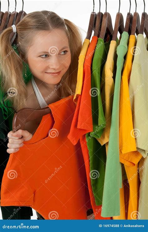 Curious Girl Looking Out Of The Clothes Rack Royalty Free Stock Photos ...