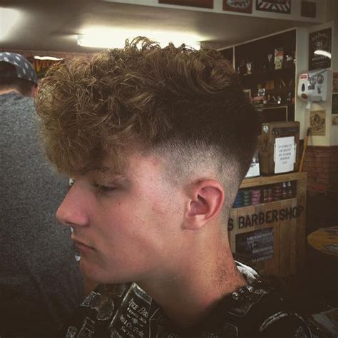 Heavy mid fade. Noodles on top everyone seems to be perming there hair atm (no I don't do perms ...