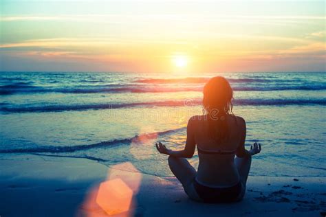 Woman Silhouette Yoga on the Beach during Sunset. Hobby. Stock Image - Image of active, practice ...