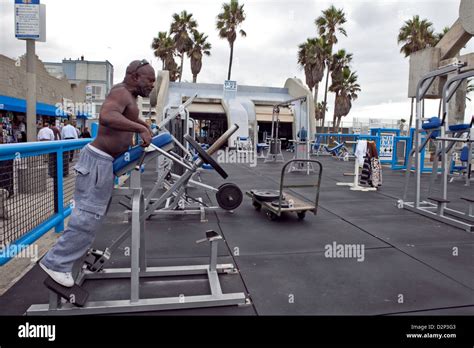 A MAN WORKING OUT AT MUSCLE BEACH GYM AT VENICE BEACH, CALIFORNIA, USA ...