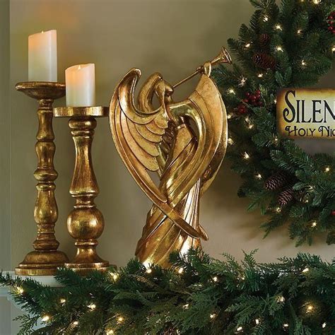 A Trumpet Playing Angel Christmas decoration gracefully heralds the season. Display indoors ...