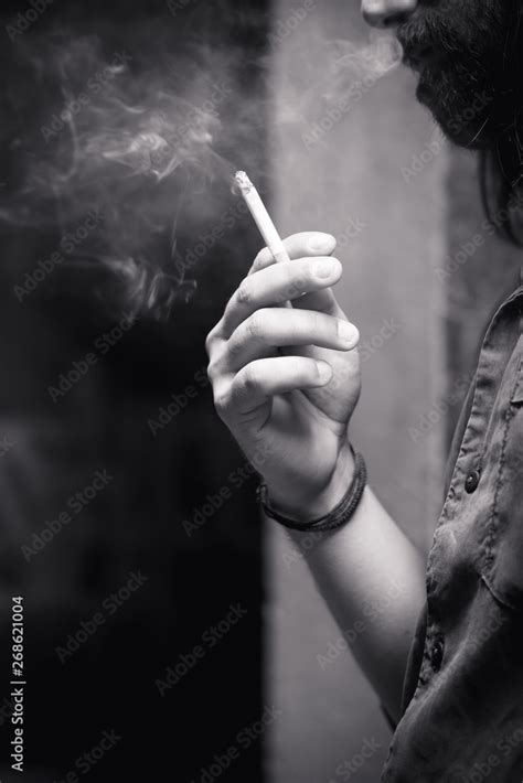 A man smoking cigarette Stock Photo | Adobe Stock