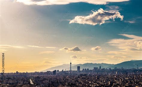 Tehran skyline in a beautiful cloudy day with golden hour light Tehran ...