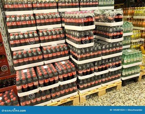 Coca Cola Soft Drink Bottles In Stacks Of Boxes At A Wholesale ...