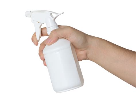 hand holding a spray bottle isolated with clipping path for mockup ...