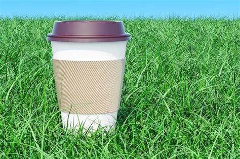 Premium Photo | Disposable cup with hot drink on the green grass against blue sky 3D rendering