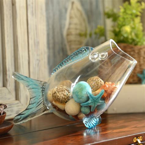 This fish-shaped bowl with blue finish fins is so fun and perfect for coastal decor! Fill it ...