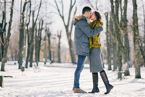 Happy Couple Walking through the Park on a Sunny Winter Day Stock Photo ...