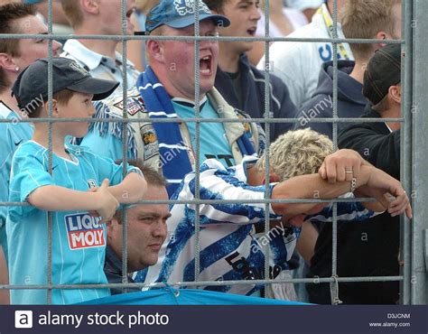 (dpa) - Fans of soccer club TSV 1860 Munich look extremely depressed after their team's 3-4 ...