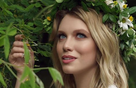 Headshot of pretty blonde woman wearing flowers head wreath - Stock ...