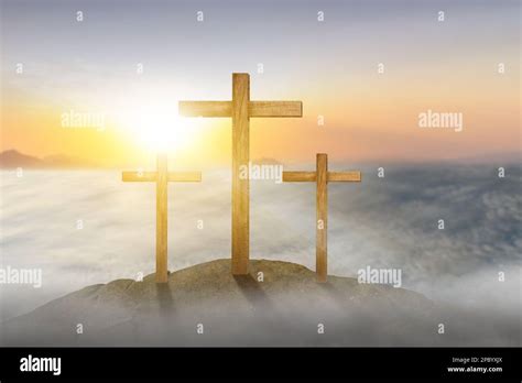 Christian Cross with sunset sky background Stock Photo - Alamy