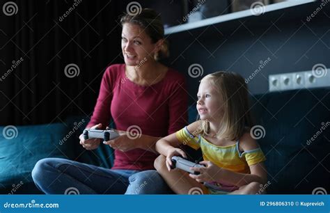 Mom and Daughter Hold Game Joysticks and Play Online Games Stock Photo ...