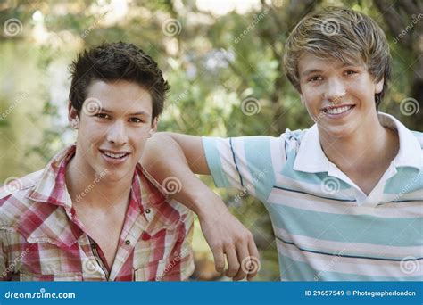 Young Male Friends Smiling stock image. Image of adventure - 29657549