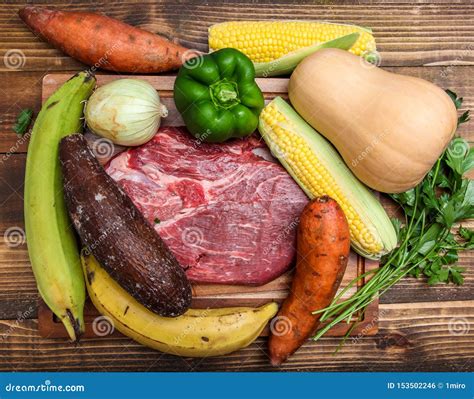 Vegetables and Meat on Wooden Background for Sancocho - Puerto Rican Beef Stew Stock Photo ...