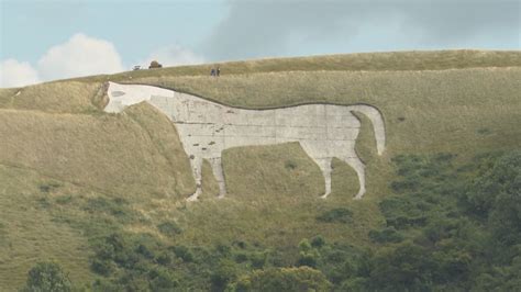 Wiltshire's oldest white horse gets a belated spring clean from English Heritage | ITV News West ...