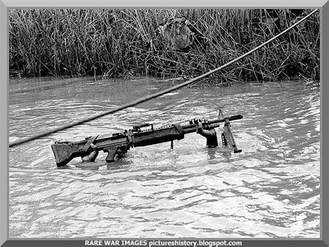 Saving his gun. Mekong Delta. 1968 ....powerful photo. This is an American solider during the ...