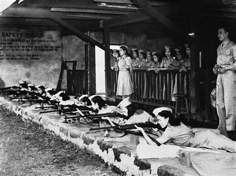 The Philippines, World War II: The first women's auxiliary corps train themselves at a rifle ...