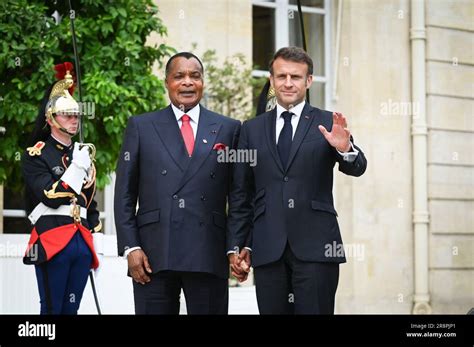 Paris, France. 22nd June, 2023. French President Emmanuel Macron greets ...