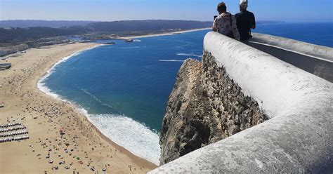 Title: "Experience the Breathtaking Sea Views and World Record Waves at Nazaré's Lighthouse ...