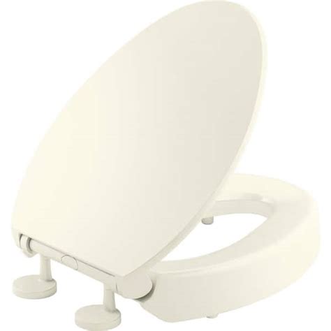 KOHLER Hyten Elevated Quiet-Close Elongated Toilet Seat in Biscuit ...