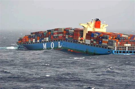 Laboring in foul weather, the MOL Comfort breaks her back in the Indian Ocean on June 17, 2013 ...