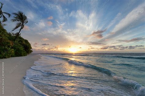 Sunrise over the Indian Ocean from a deserted beach in the Northern ...