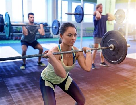 Group of People Training with Barbells in Gym Stock Photo - Image of ...