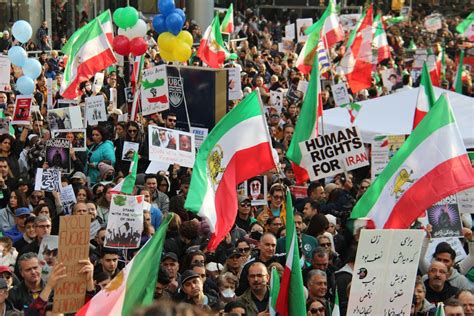 Crowd of People Protesting on Street Holding Flags and Posters · Free Stock Photo