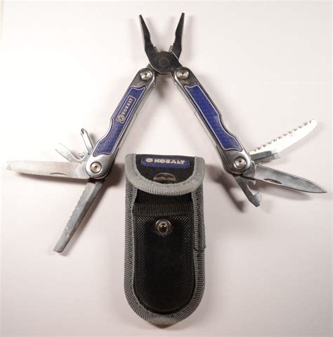 1-Used Kobalt Multi-Tool with Black Pouch and One Smaller Multi-Tool