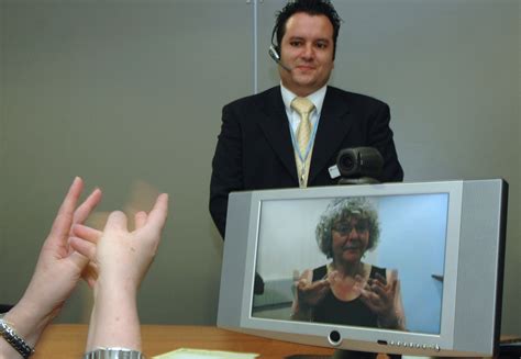 File:A Video Relay Service session helping a Deaf person communicate with a hearing person via a ...