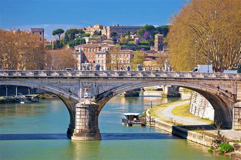 Rome riverfront and Tiber river bridges Photograph by Brch Photography