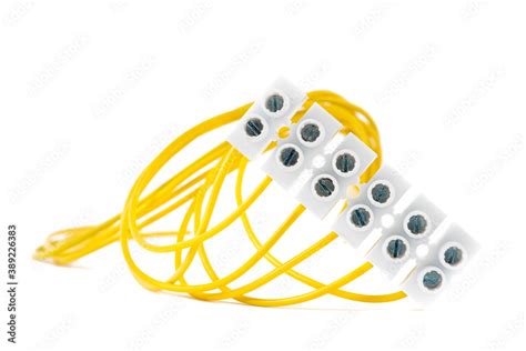 Electrical cable connected to terminal block isolated on white ...