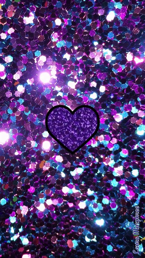 a purple heart is surrounded by glitter