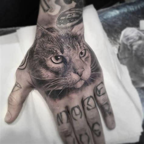 Cat face on hand tattoo by Andrey Barmaley (@barmaleytattoo) | Tattoos, Hand tattoos, Cat tattoo