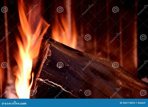 Log on fire in fireplac stock image. Image of night - 266713023