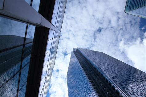 Fish Eye View Photo of Glass High Story Building over White Cloudy Sky during Daytime · Free ...