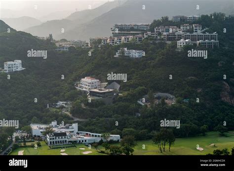 Houses on the hillside above Hong Kong Golf Club, Deep Water Bay, viewed from a highrise ...