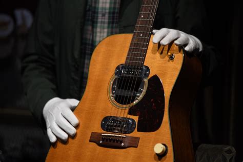 Kurt Cobain’s MTV ‘Unplugged’ Guitar Rakes in $6 Million - Bloomberg