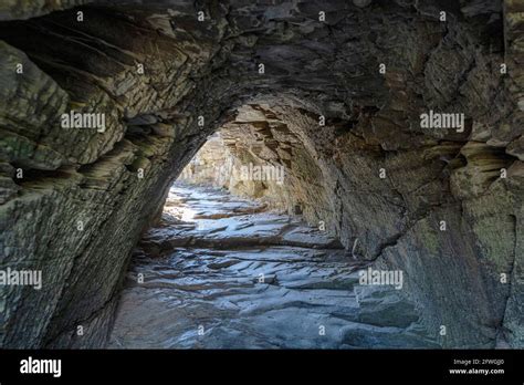 The entrance to Merlin's Cave, Tintagel Castle, Tintagel, Cornwall, UK ...