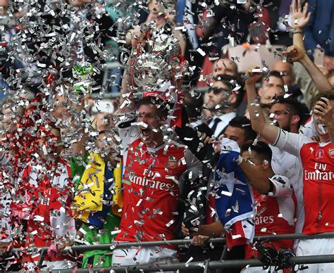 Arsenal lift the 2017 FA Cup trophy at Wembley - Daily Star