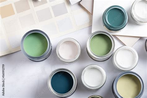 Tiny sample paint cans during house renovation, process of choosing ...