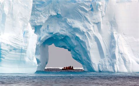 Boat and iceberg, ice floe in the Southern Ocean, 180 miles north of ...